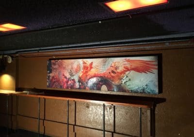 Sublimated artwork fabric acoustic treatment stretched fabric panel hung in Cervantes Masterpiece ballroom venue upper bar