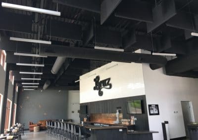 Bruz restaurant Interior Ceiling Detail with black acoustic treatment stretched fabric baffles