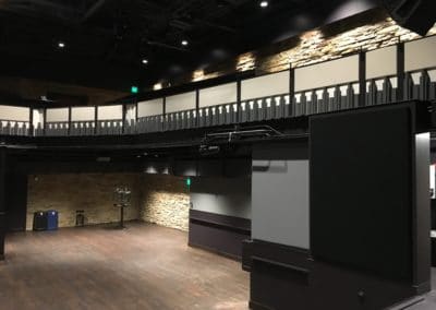 Washington's Fort Collins Venue Interior Detail showing black acoustic treatment stetched fabric on walls and beige acoustic panels on balcony