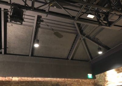 Washington's Fort Collins Venue Interior Detail showing black acoustic treatment insulation on black industrial domed ceiling